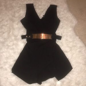 Black jumpsuit with gold belt
